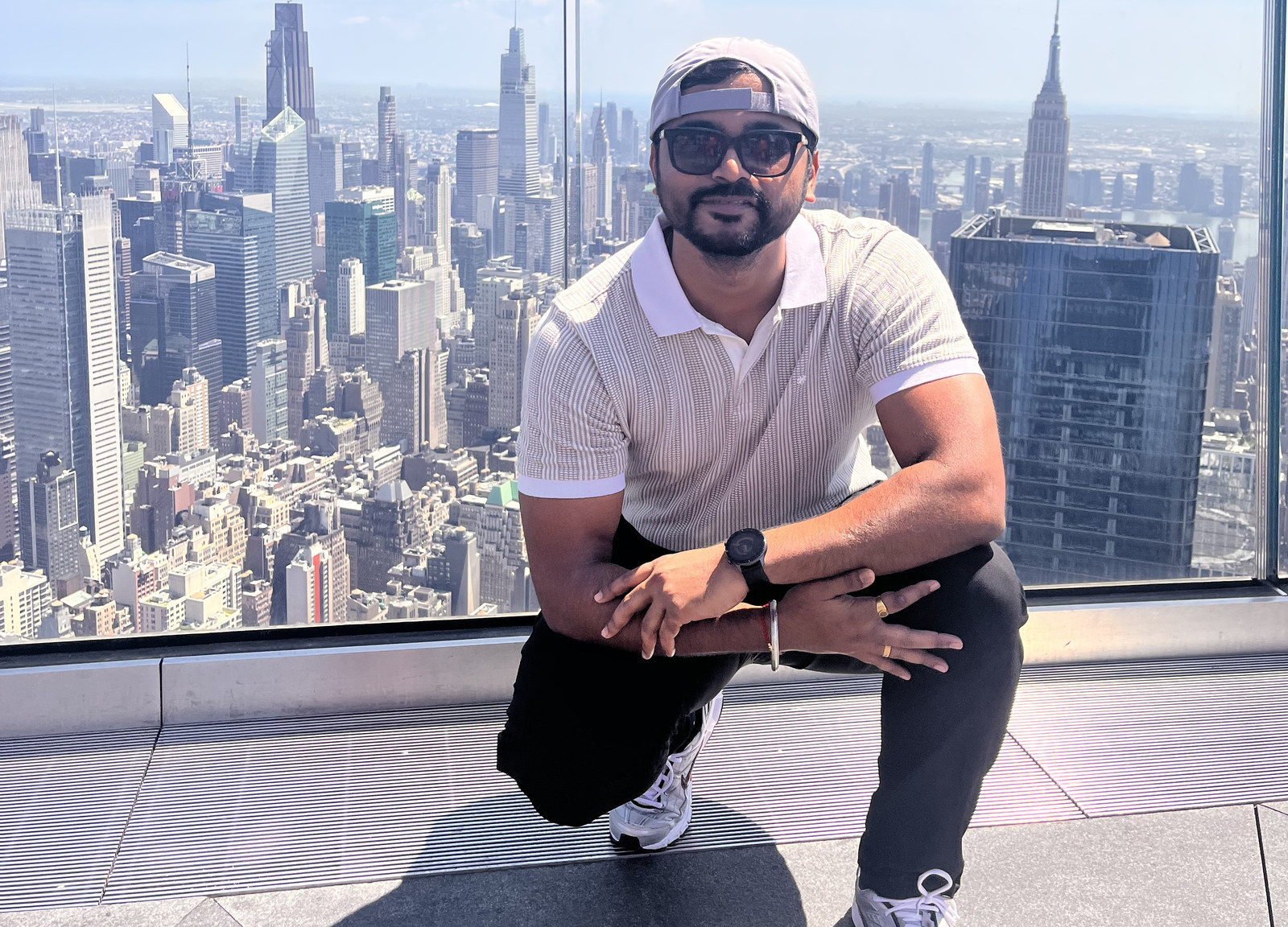 Ankit Dongare with the New York City skyline behind him